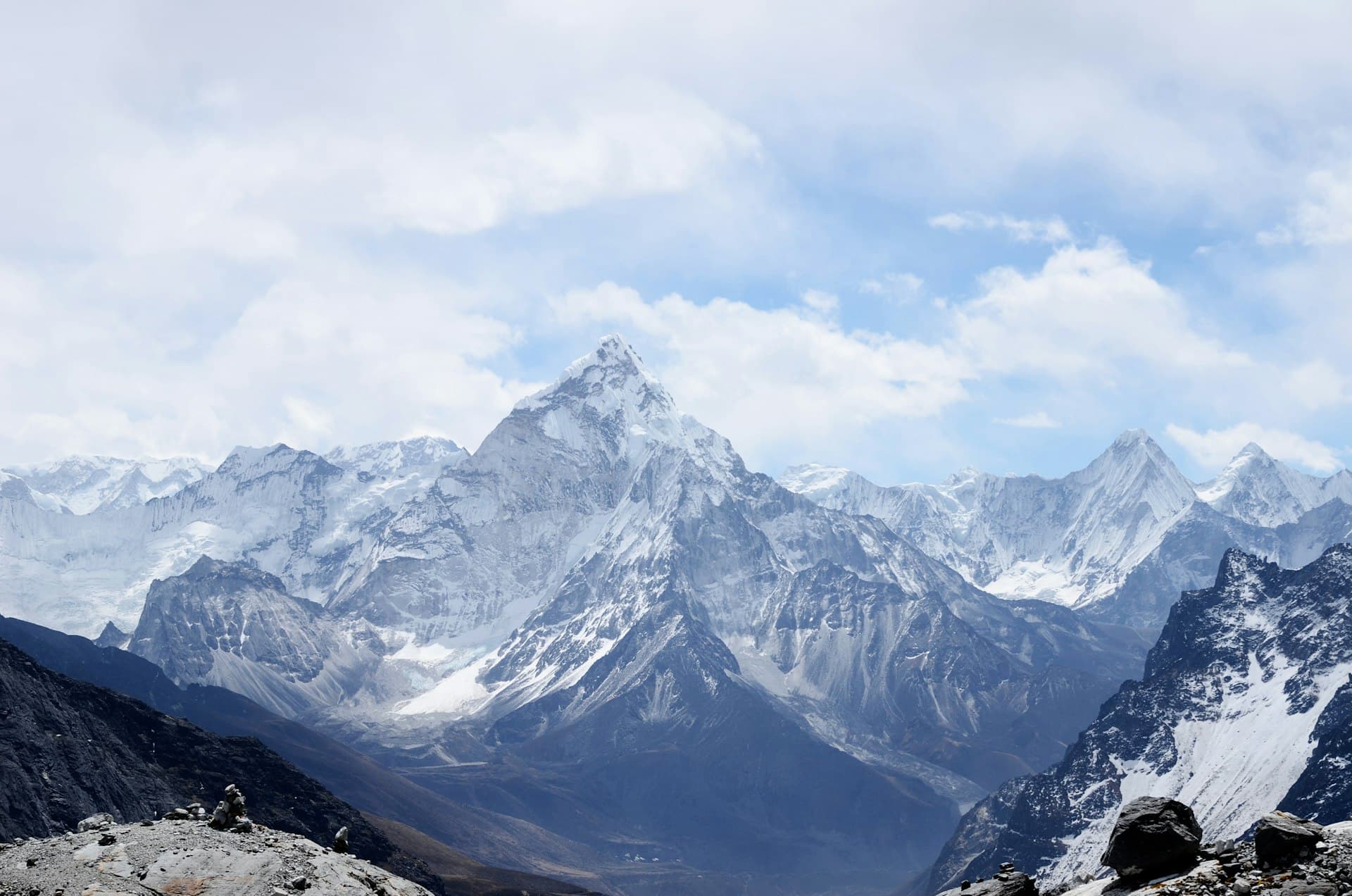 Snow-capped peaks towering above alpine forest in Glacier National Park