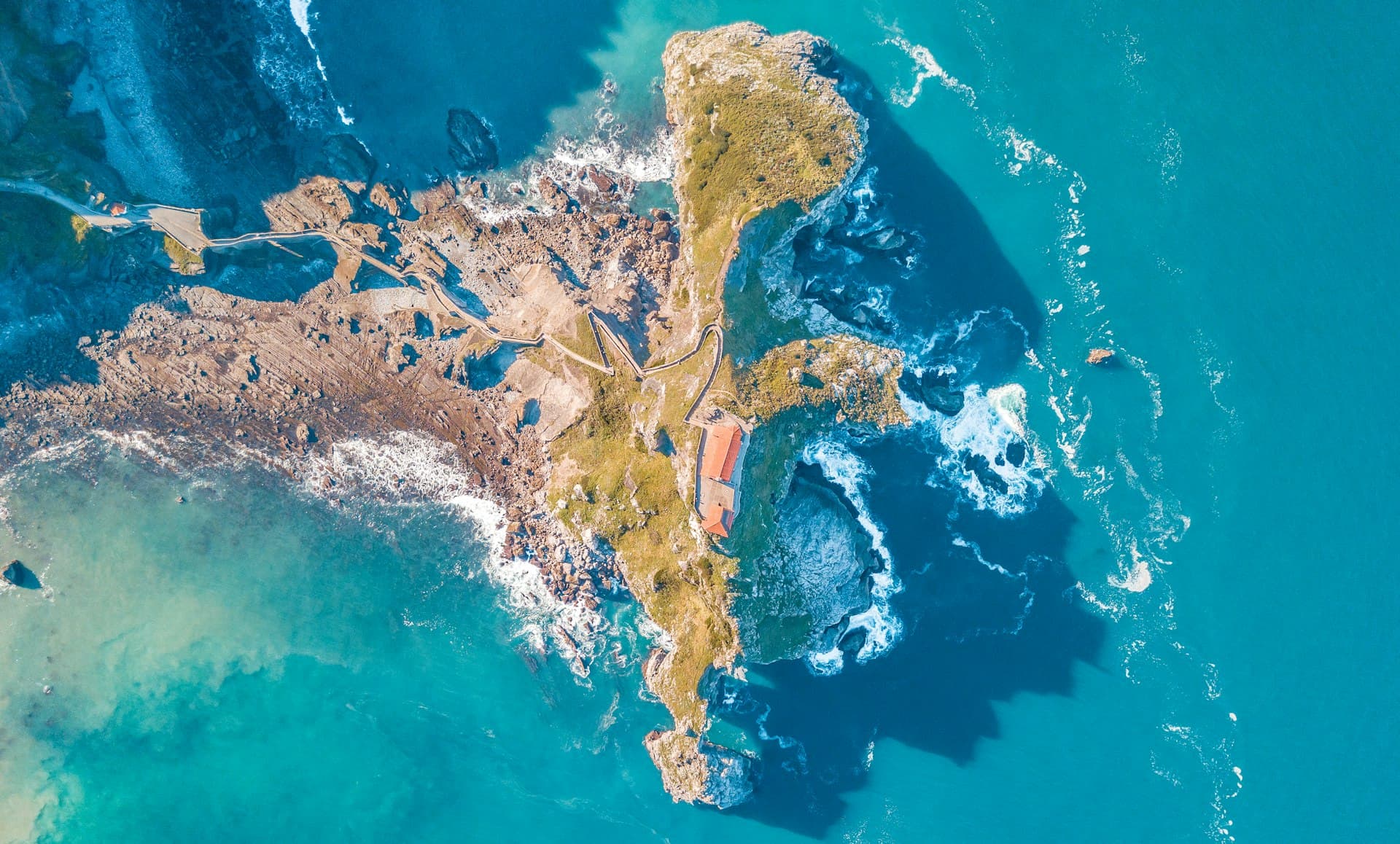 San Luis Obispo's rolling green hills meeting the Pacific coastline under golden afternoon light
