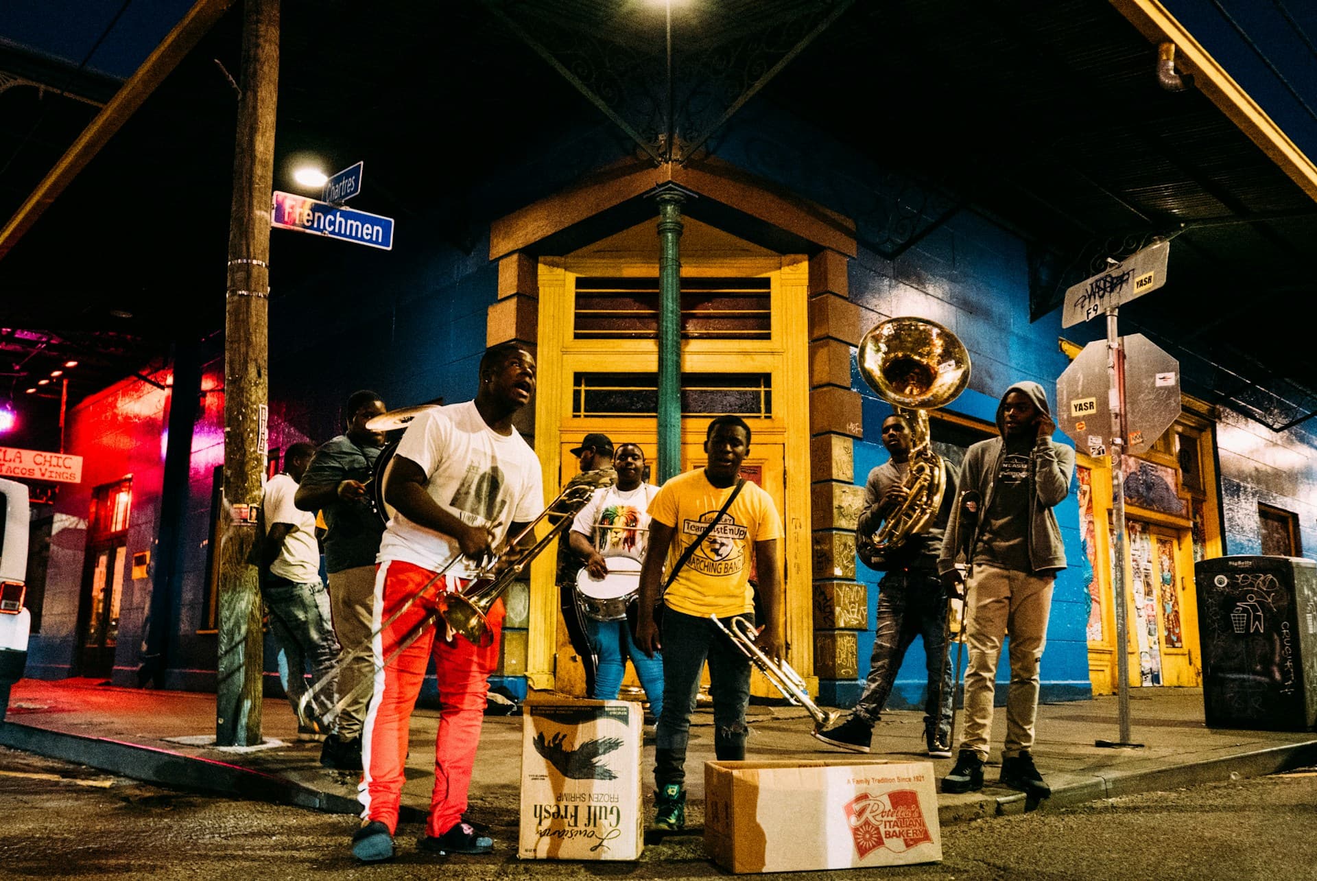 French Quarter street at night with jazz light spilling from open doorways